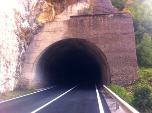 One of the many invitingly pitch black tunnels through the Montenegrin hills.